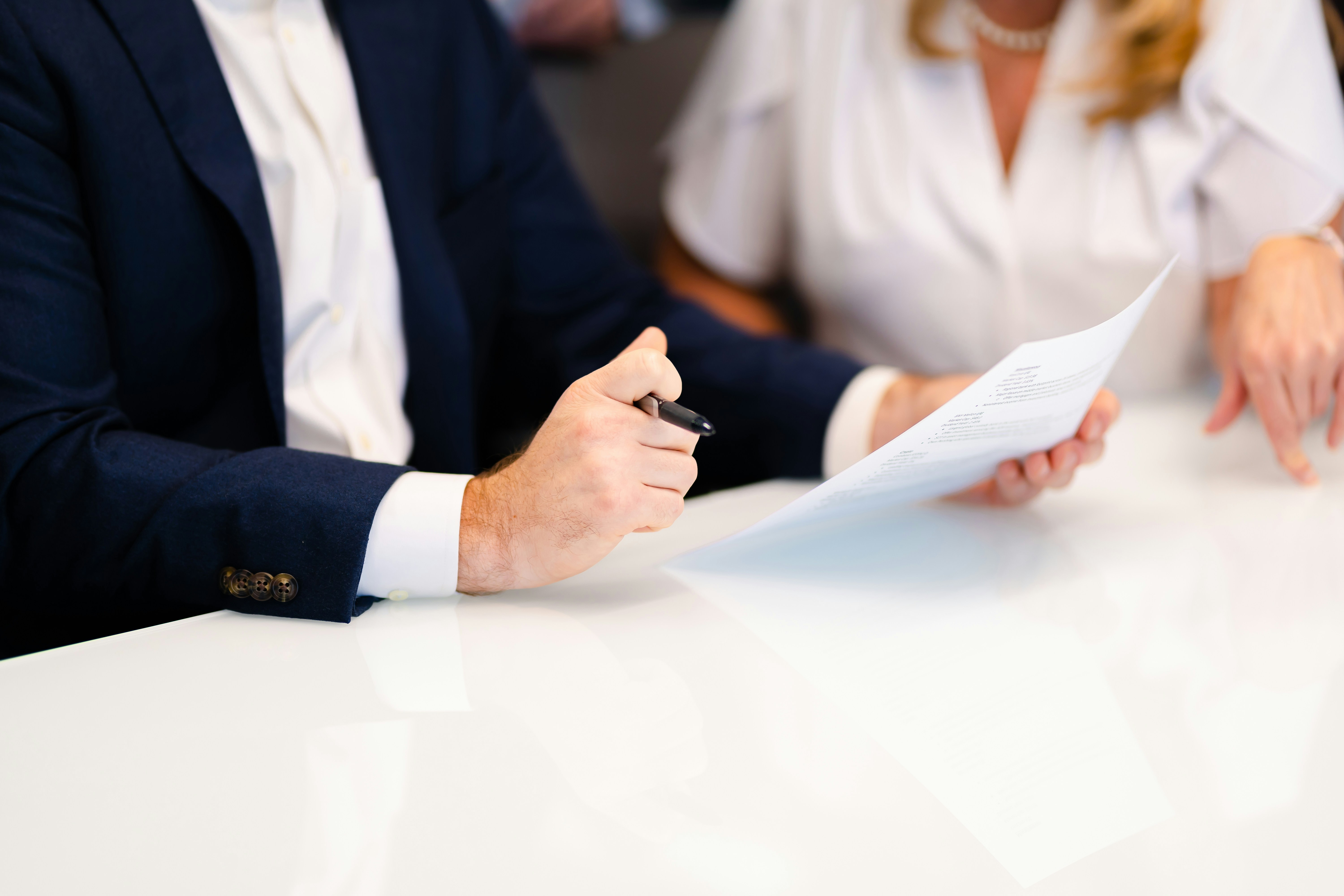 Attorney and professional reviewing documents